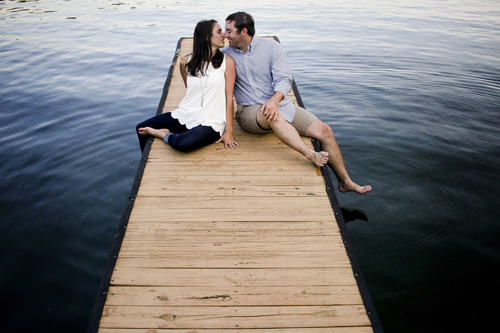 couple kisses on dock