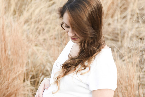 pregnant mother holding belly