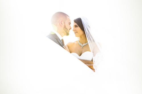 bride and groom in bright white light